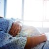 Factors Associated with Hospitalization with Symptomatic COVID-19 Illness Among Pregnant Individuals: A Multi-Center Retrospective Cohort Study